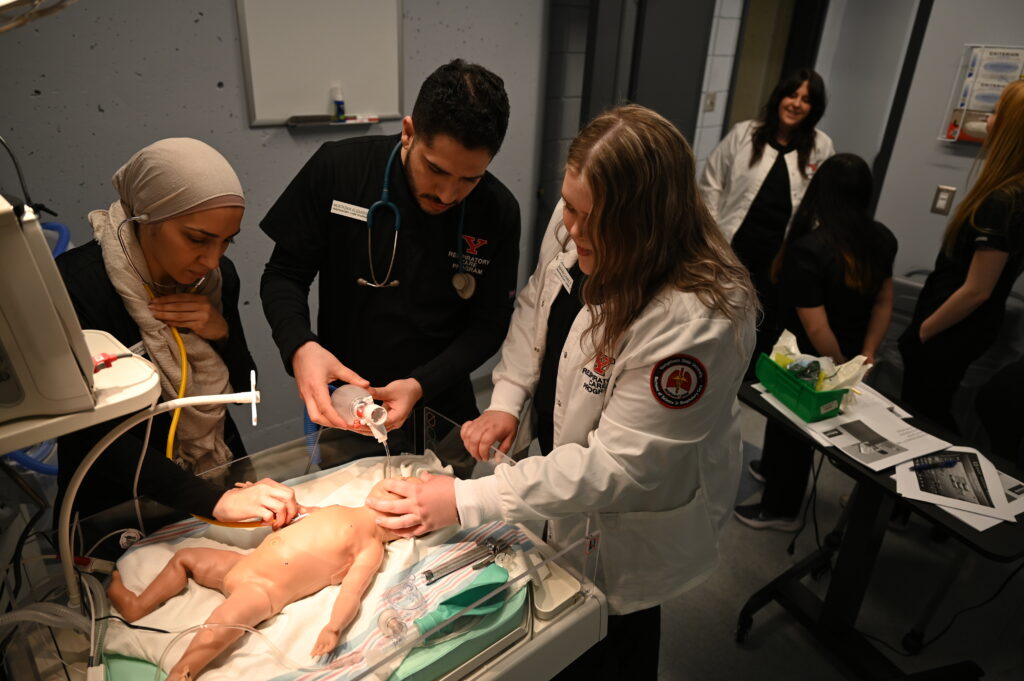 Respiratory Care students practice neonatal patient care using the Baby Tori high-fidelity simulator in YSU's Respiratory Care Simulation Lab.