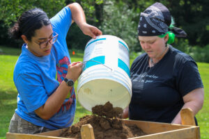 YSU anthropology students sift artifacts from dirt in Archeological Techniques course.