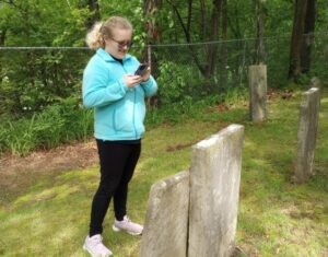 YSU English and History student, India Gatts cataloguing the Pioneer Cemetary graves